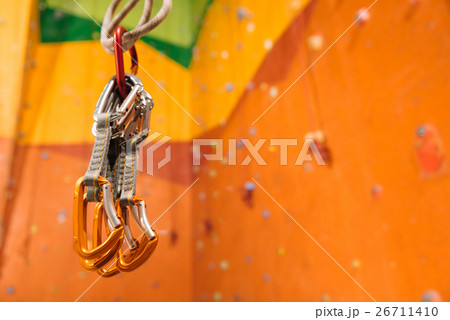 Close up of climbing equipment hanging in gym Close up of climbing equipment hanging in gym 26711410