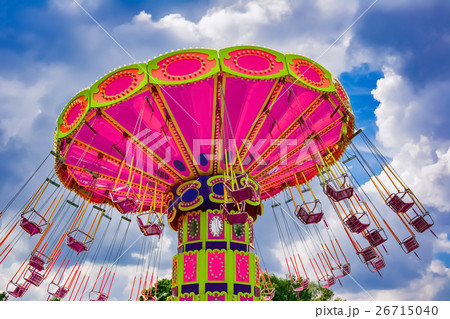 Colorful flying swing ride at the amusement park Colorful flying swing ride at the amusement park 26715040