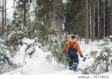 man with hatchet in the hands of carries Christmas man with hatchet in the hands of carries Christmas 26718622
