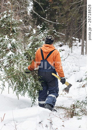 man with hatchet in the hands of carries Christmas 26718626