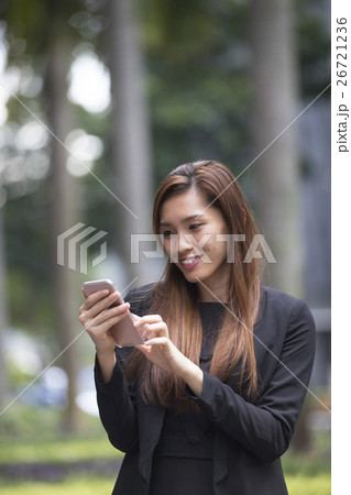 Asian businesswoman using her smart phone. 26721236