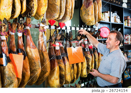Customer buying iberico or serrano jamon leg 26724154