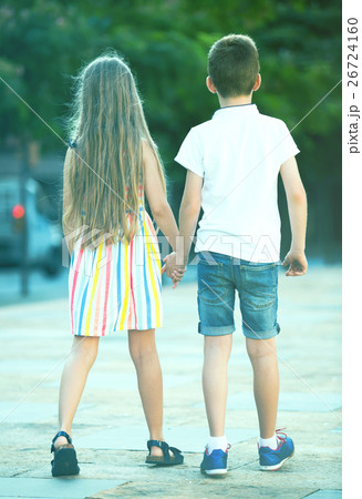 Two kids walking together outdoor Two kids walking together outdoor 26724160