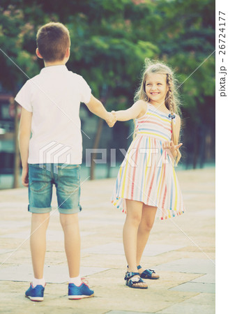 little girl dancing with friend outdoor. 26724177