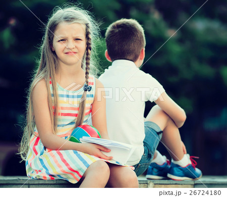 disappointed girl in having problem with friend outdoors in park 26724180