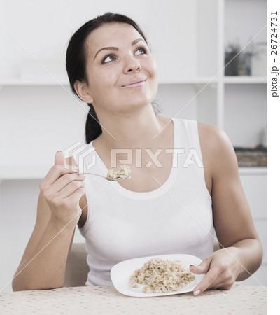 Girl eat porridge 26724731