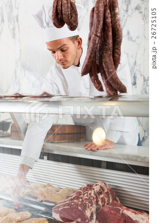 Positive professional cook laying out food Positive professional cook laying out food 26725105