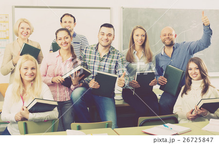 Positive professor and group of students. Positive professor and group of students. 26725847