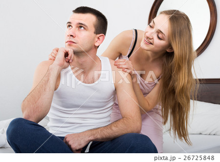 wife warmly comforting upset husband in bedroom wife warmly comforting upset husband in bedroom 26725848