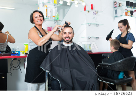 hairdresser and client in beauty salon . hairdresser and client in beauty salon . 26726622