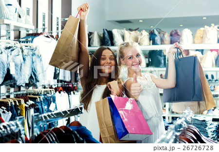 Girls holding shopping paper bags Girls holding shopping paper bags 26726728