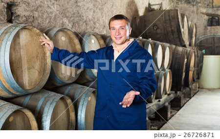Man wine house technician working in storage Man wine house technician working in storage 26726871