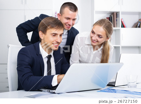 Three sociable coworkers different sexes working in company office Three sociable coworkers different sexes working in company office 26727150