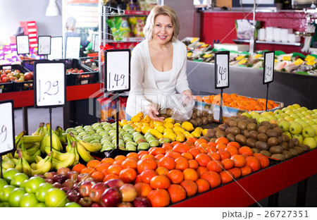 Female pensioner buying fresh fruits Female pensioner buying fresh fruits 26727351