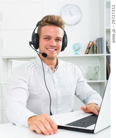 Young man working in call centre Young man working in call centre 26727352