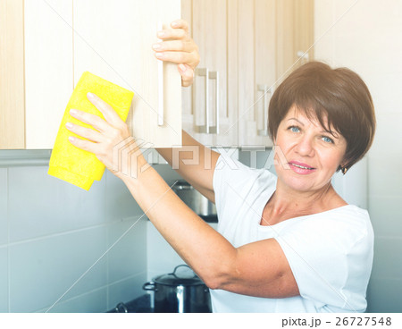 senior woman cleaning senior woman cleaning 26727548