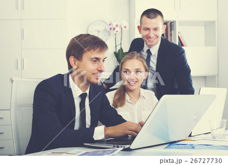 Business colleagues occupied with laptops 26727730