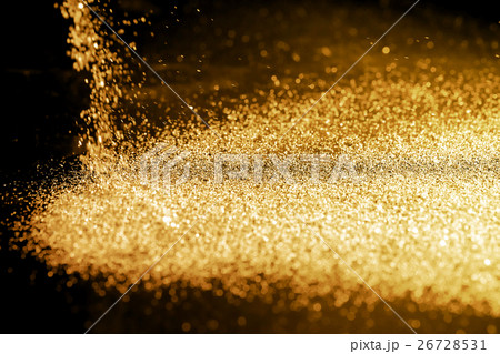 Sprinkle gold dust on a black background  26728531