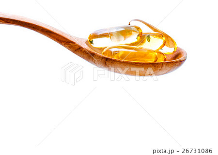 Spoonful of gel capsules of omega 3. Spoonful of gel capsules of omega 3. 26731086