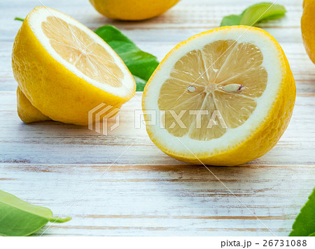 Closeup fresh lemons and lemons leaves. Closeup fresh lemons and lemons leaves. 26731088