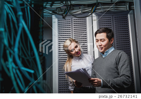 Young engineers businessmen in server room Young engineers businessmen in server room 26732141