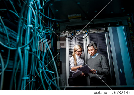 Young engineers businessmen in server room 26732145