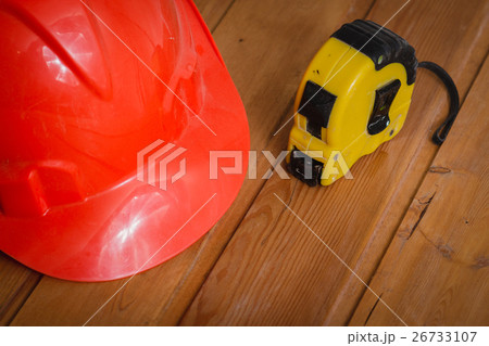 construction helmet and a tape measure construction helmet and a tape measure 26733107