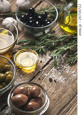 Olives with different seasoning on the table 26736722
