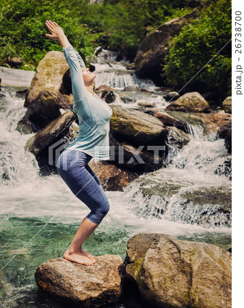 Sorty fit woman doing yoga asana Utkatasana Sorty fit woman doing yoga asana Utkatasana 26738700