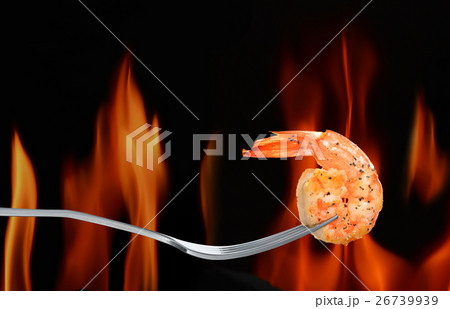 Cooked shrimp,prawn on fork on flame background Cooked shrimp,prawn on fork on flame background 26739939