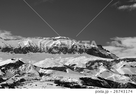 Black and white snowy mountains at sun winter day 26743174