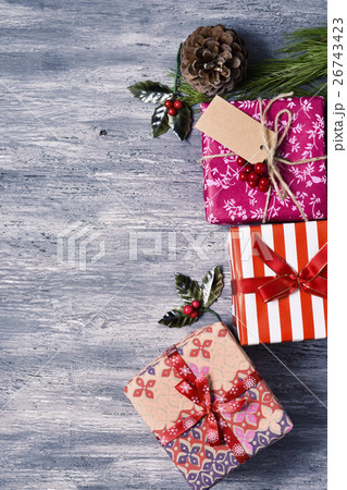 christmas gifts on a wooden surface christmas gifts on a wooden surface 26743423