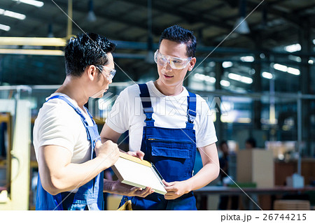 Carpenter team in Asian wood workshop 26744215