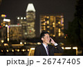 Asian businessman using smart phone in city at night. 26747405