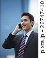 Chinese business man talking on a mobile phone 26747410