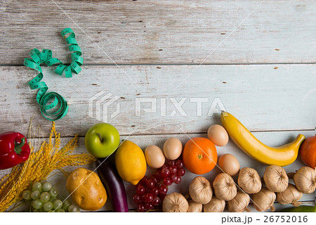 Measuring tape on fruits. Symbol of diet. 26752016