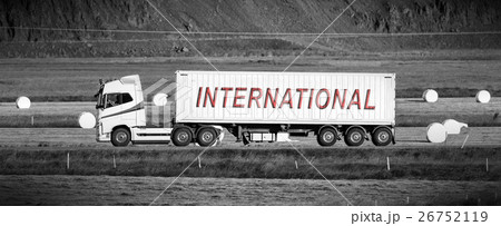 Truck driving through a rural area - International 26752119