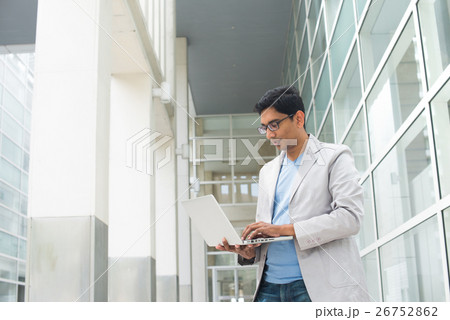 indian male using laptop outdoor indian male using laptop outdoor 26752862