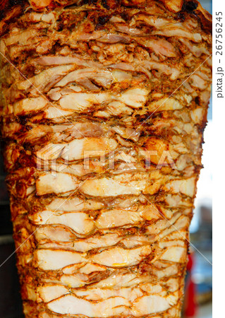Shawarma meat being cut 26756245