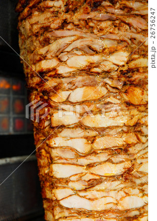 Shawarma meat being cut 26756247