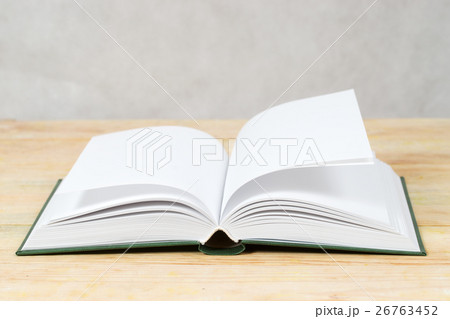 Open book on wooden table. Back to school. Copy 26763452