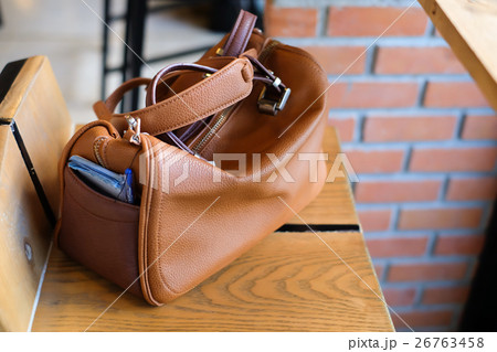 Lady bag on chair in cafe Lady bag on chair in cafe 26763458