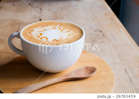 caramel coffee in white cup on wood table 26763459