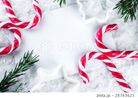 Clear paper laying with candy cane. Clear paper laying with candy cane. 26763625