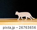 Wooden cat on table dark background  26763656