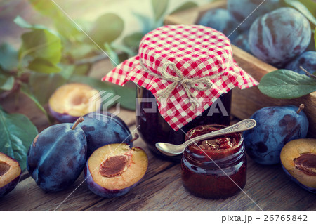 Homemade plum jam and fruits on a wooden table. 26765842