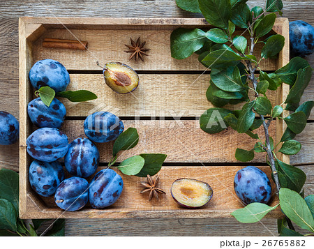 Fresh plums in wooden box. Top view, flat lay. Fresh plums in wooden box. Top view, flat lay. 26765882
