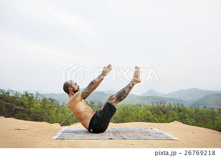 Man Doing Yoga Exercise Concept 26769218