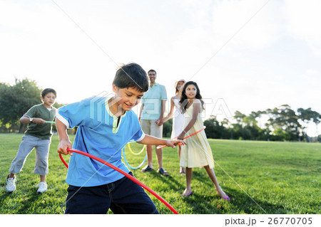 Hula Hoop Enjoying Cheerful Outdoors Leisure Concept Hula Hoop Enjoying Cheerful Outdoors Leisure Concept 26770705