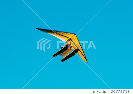 Motorized Hang Glider Flying On Blue Clear Sunny 26772718
